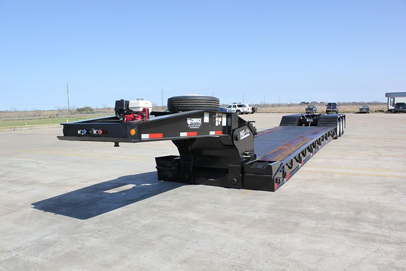 Gooseneck of an NG-Pro lowboy with a Honda hydraulic power unit and spare tire